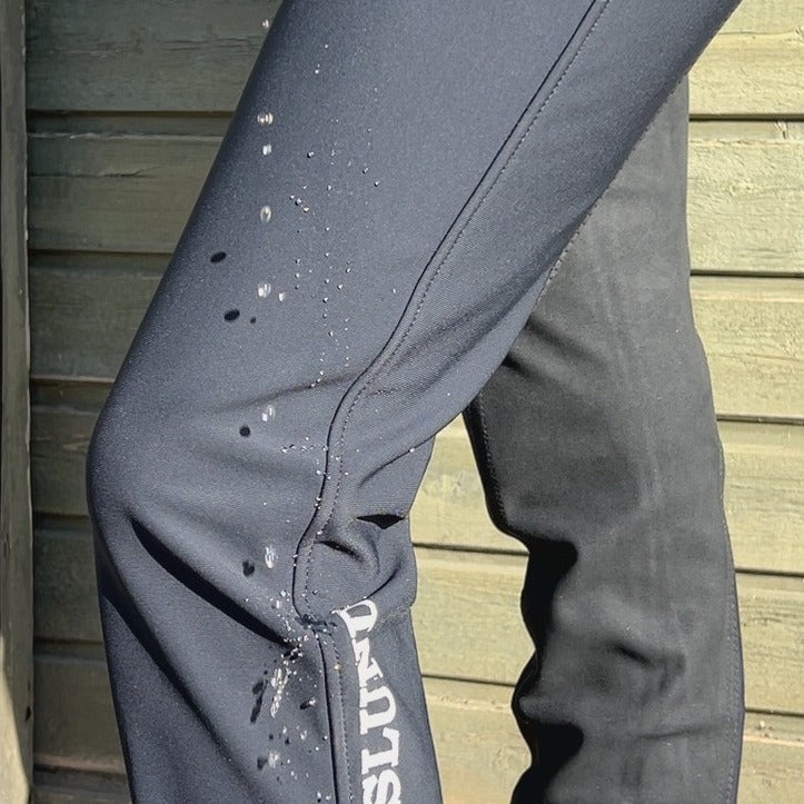 Jodhpursridbyxor Jökull i softshell, med mobilficka, helskodda läderimitation